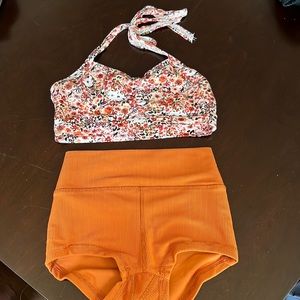 Five dancewear orange ribbed briefs with floral bra top